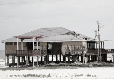 wind damage - spray foam can help prevent uplift to New Orleans roofs